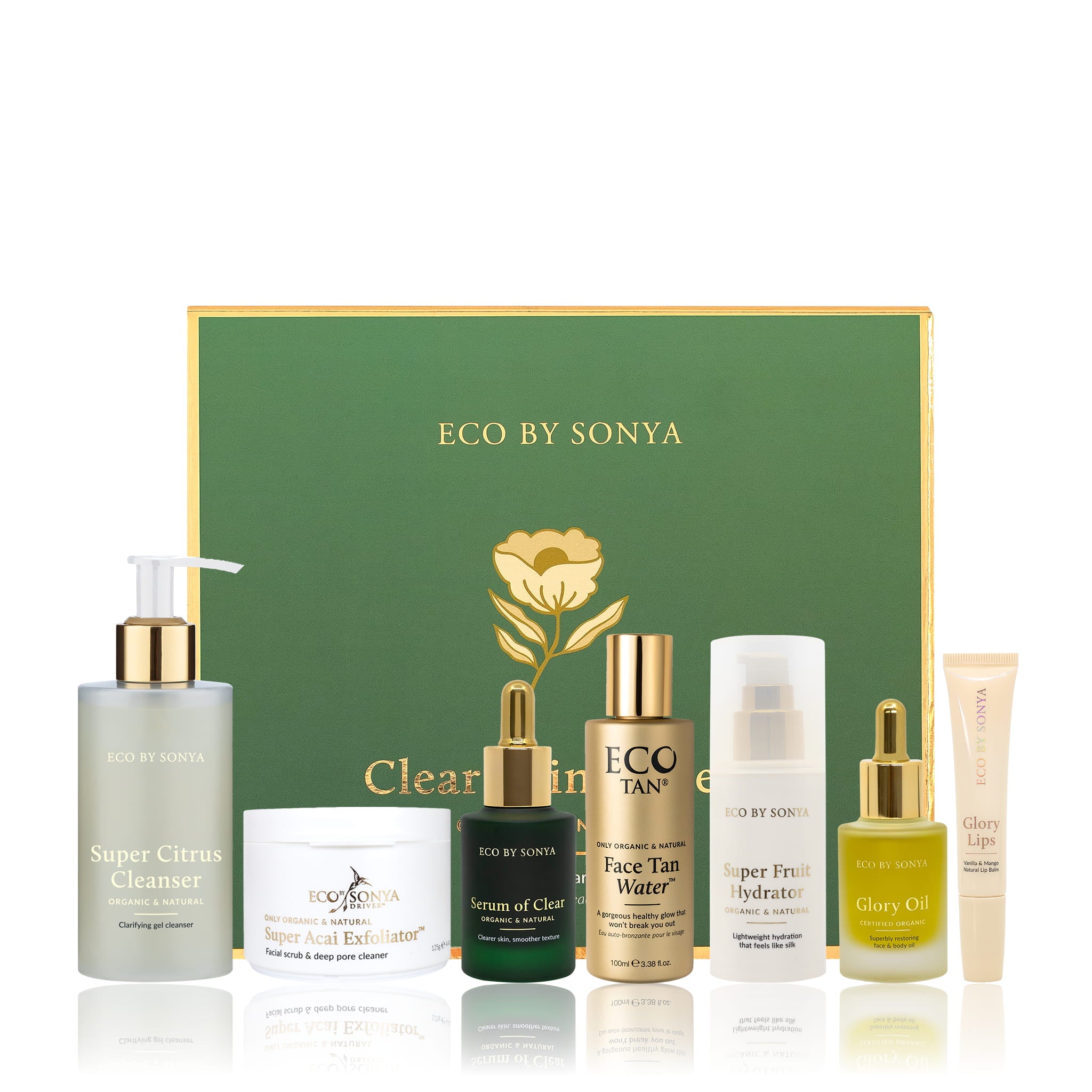 A collection of Eco By Sonya Clear Skin System products, including cleanser, serum, oil, Face Tan Water, hydrator, exfoliator and bonus lip balm, arranged together on a clean background.