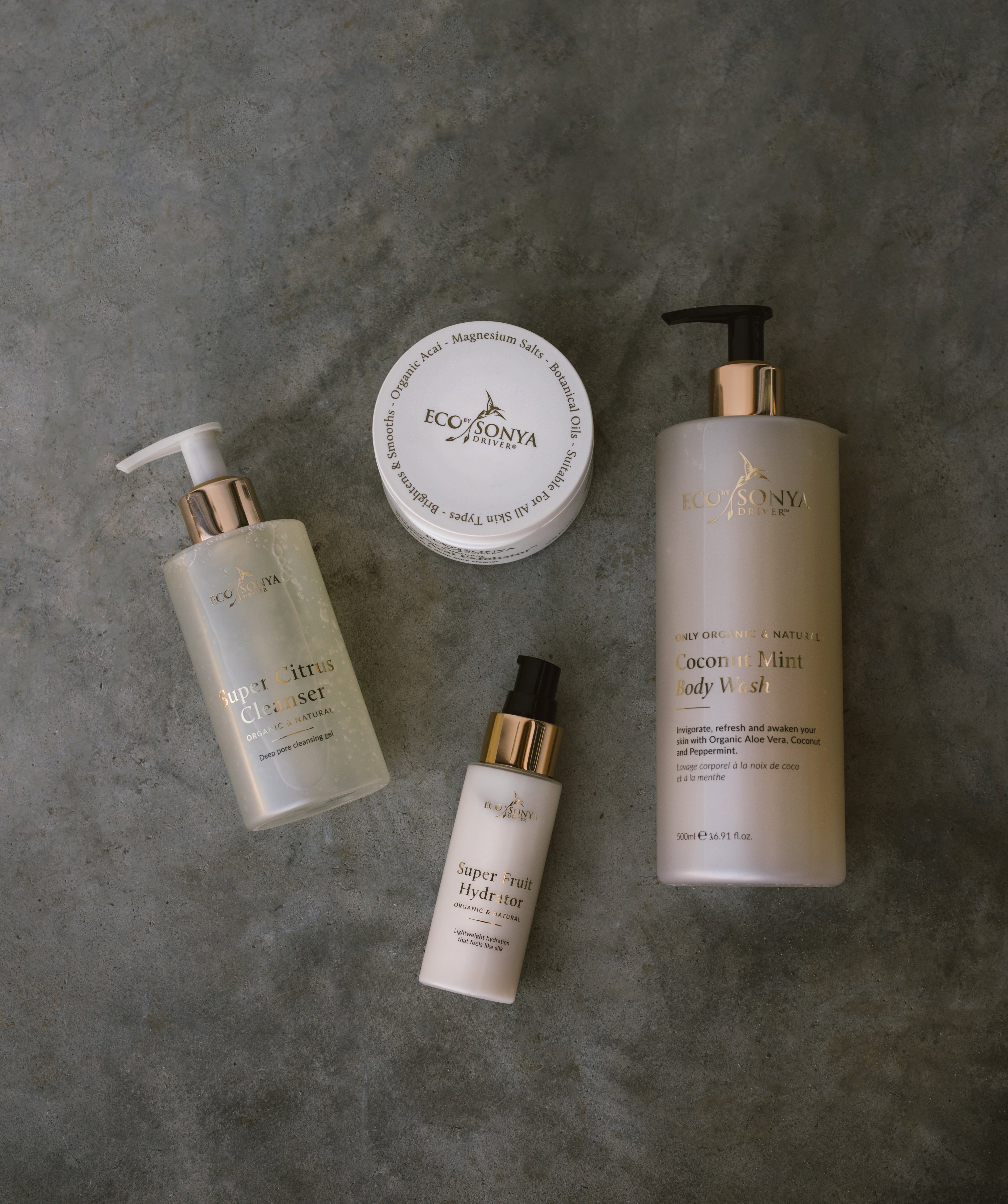 Set of Eco by Sonya skincare products on a gray surface